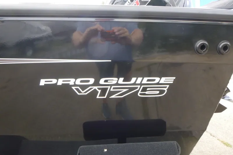 Slide: The Image of 2026 Tracker Pro Guide V-175 Combo boat side view with logo. - 15