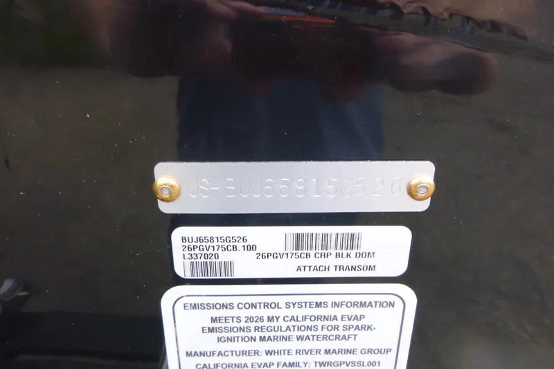 Slide: The Image of 2026 Tracker Pro Guide V-175 Combo transom with identification and emissions labels. - 16