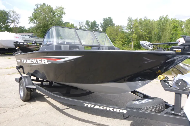 Slide: The Image of 2026 Tracker Pro Guide V-175 Combo boat on trailer, parked outdoors. - 3