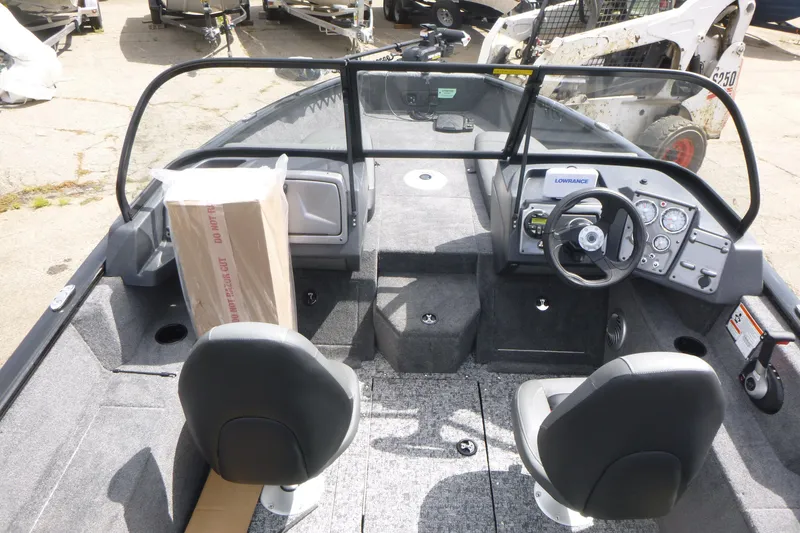 Slide: The Image of 2026 Tracker Pro Guide V-175 Combo boat interior with steering console and seating. - 5