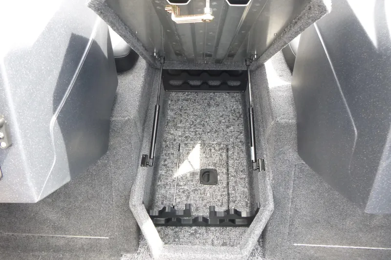 Slide: The Image of 2026 Tracker Pro Guide V-175 Combo boat storage compartment with carpeted interior. - 8