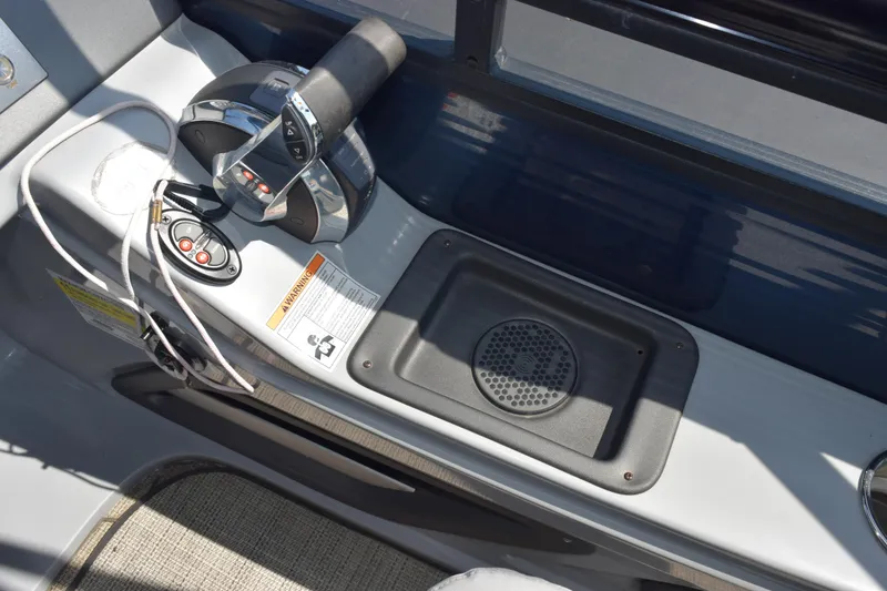 Slide: The Image of Control panel of 2020 Harris Solstice 230 boat with throttle and speaker. - 13