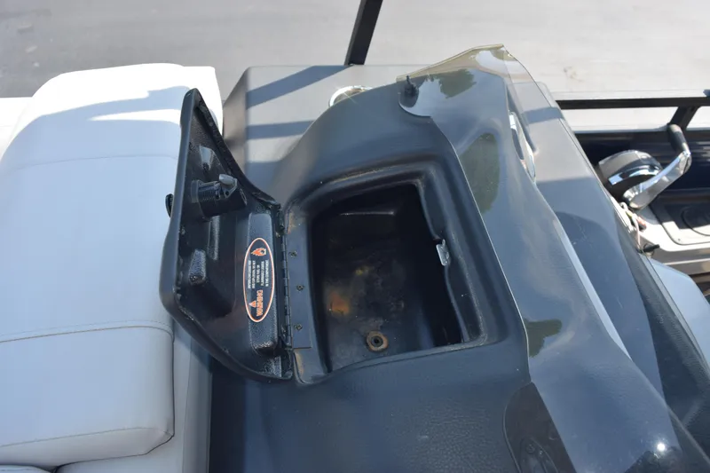 Slide: The Image of Open storage compartment on 2020 Harris Solstice 230 boat dashboard. - 17