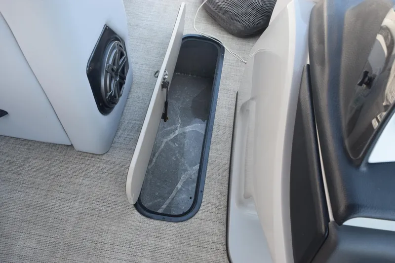 Slide: The Image of Open storage compartment on 2020 Harris Solstice 230 boat interior. - 22