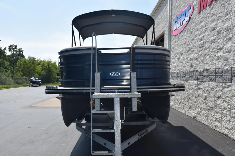 Slide: The Image of 2020 Harris Solstice 230 pontoon boat on trailer, parked outside dealership. - 3