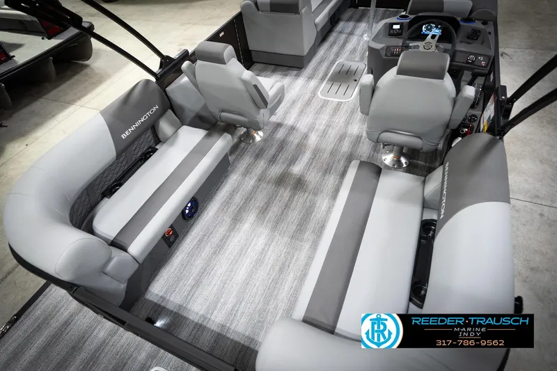 Slide: The Image of 2026 Bennington 21 SSR pontoon boat interior with gray seating and modern dashboard. - 14
