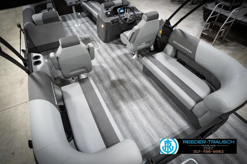 Slide: The Image of 2026 Bennington 21 SSR pontoon boat interior with gray seating and modern dashboard. - 15