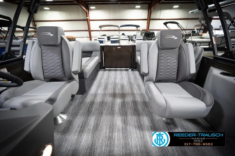 Slide: The Image of 2026 Bennington 21 SSR boat interior with gray seating and carpeted flooring. - 17