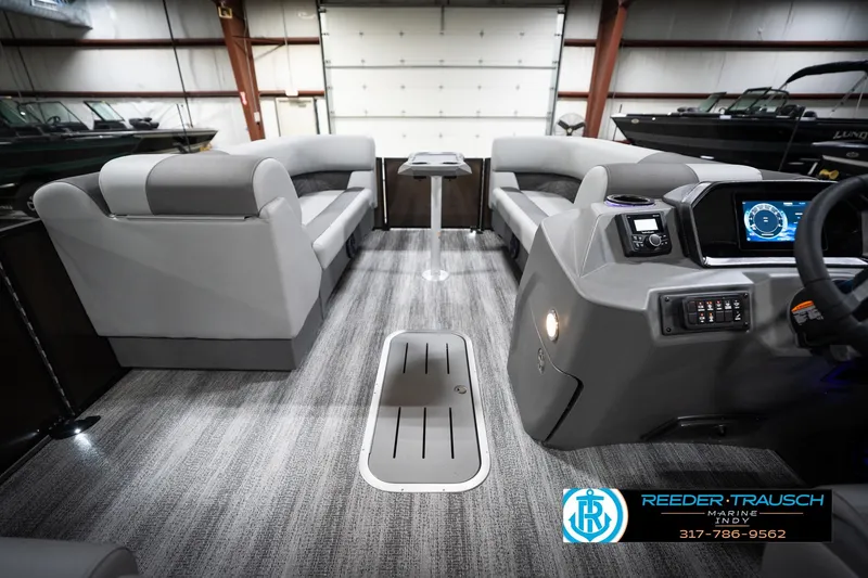 Slide: The Image of 2026 Bennington 21 SSR pontoon boat interior with modern dashboard and seating. - 20