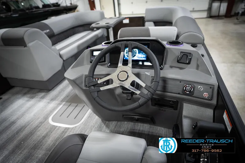 Slide: The Image of 2026 Bennington 21 SSR boat interior with modern steering console and seating. - 30