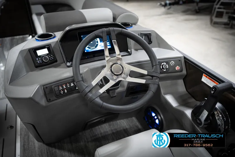 Slide: The Image of 2026 Bennington 21 SSR boat dashboard with steering wheel and control panel. - 31
