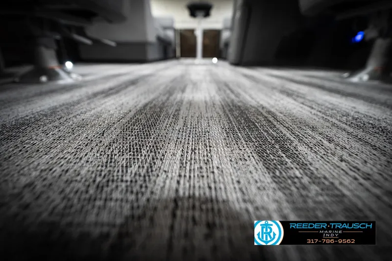 Slide: The Image of Carpeted floor of a 2026 Bennington 21 SSR boat interior, close-up view. - 45