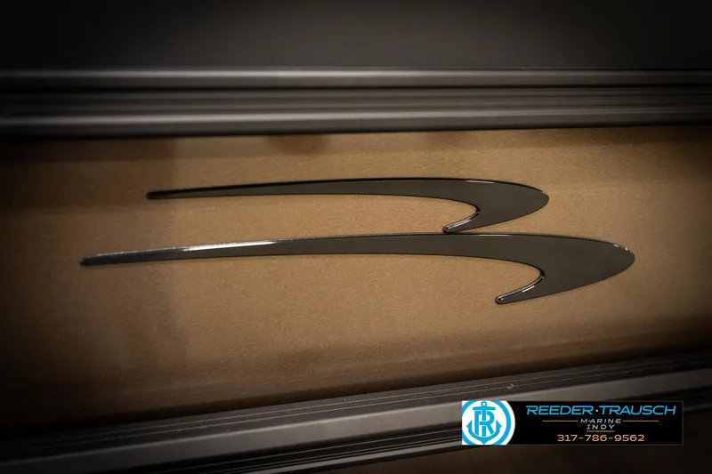 Slide: The Image of Close-up of 2026 Bennington 21 SSR logo on a sleek metallic surface. - 46