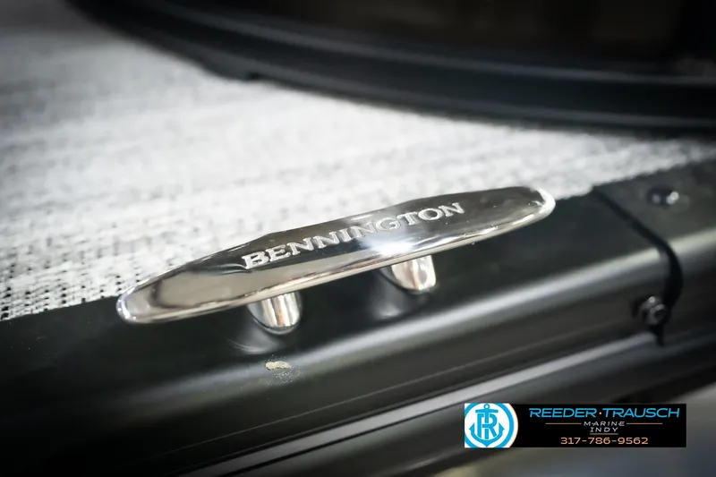 Slide: The Image of 2026 Bennington 21 SSR boat cleat with logo, featuring Reeder-Trausch Marine contact details. - 56