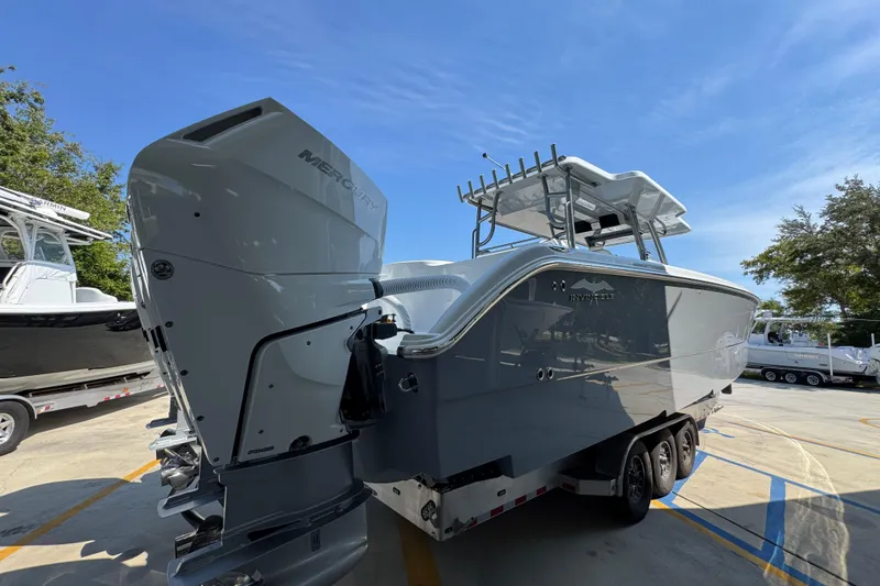 Slide: The Image of 2026 Invincible 40 Catamaran with Mercury outboard engines on a trailer. - 12