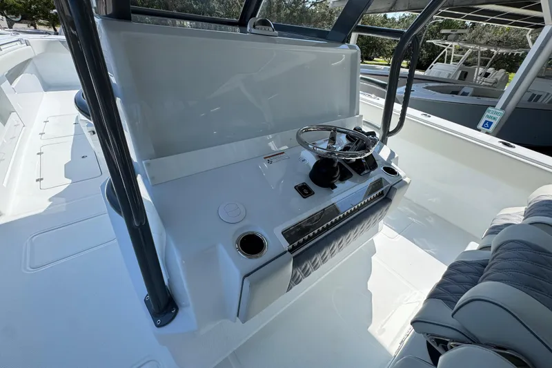Slide: The Image of 2026 Invincible 40 Catamaran helm with steering wheel and seating area. - 28