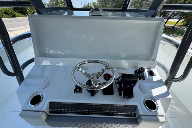 Slide: The Image of Helm of 2026 Invincible 40 Catamaran with steering wheel and controls. - 29