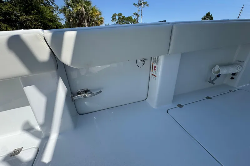Slide: The Image of 2026 Invincible 40 Catamaran interior detail with storage compartment and clean white finish. - 34