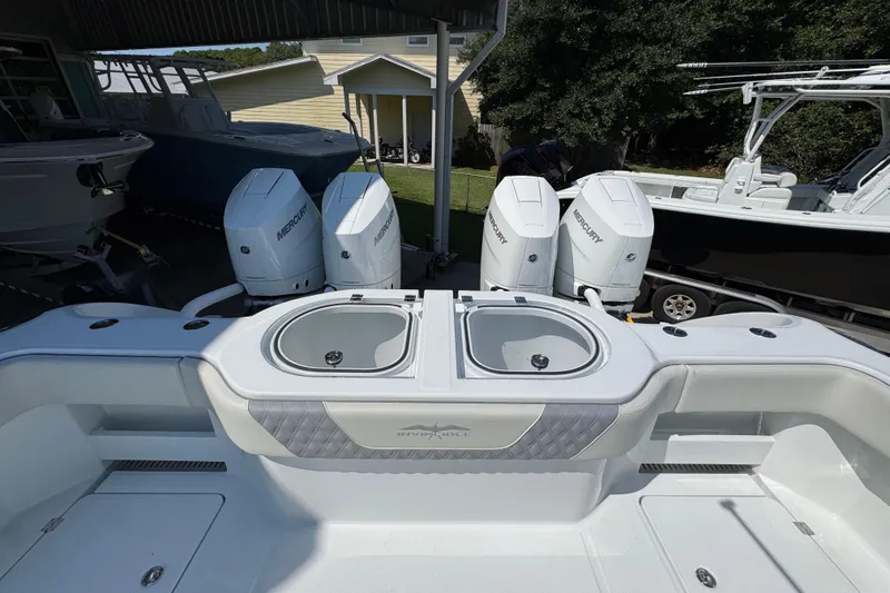 Slide: The Image of 2026 Invincible 40 Catamaran with Mercury engines, featuring dual livewells and spacious deck. - 36
