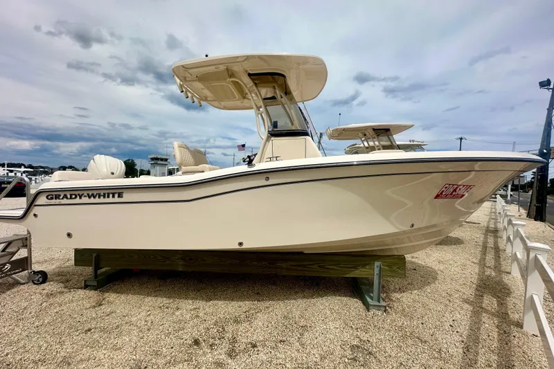 The Image of 2026 Grady-White Fisherman 216 boat displayed on gravel, available for sale. - 1