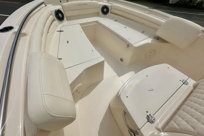 Slide: The Image of 2026 Grady-White Fisherman 216 boat interior with cushioned seating and storage compartments. - 11