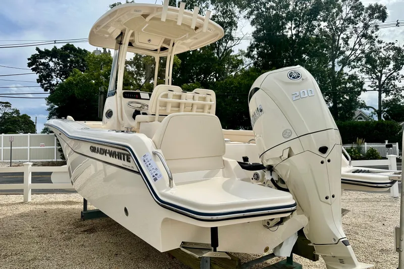Slide: The Image of 2026 Grady-White Fisherman 216 boat with Yamaha 200 engine, displayed outdoors. - 3