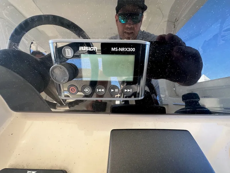 Slide: The Image of Close-up of Fusion MS-NRX300 audio system on 2019 Boston Whaler 350 Realm boat. - 11