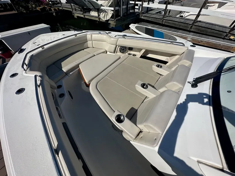 Slide: The Image of 2019 Boston Whaler 350 Realm boat with spacious seating and cup holders. - 15
