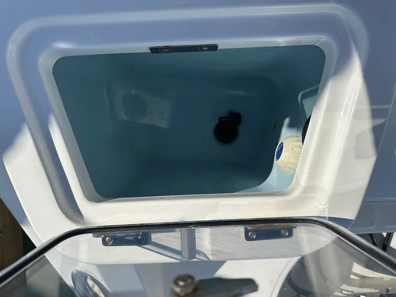 Slide: The Image of Open storage compartment on a 2019 Boston Whaler 350 Realm boat. - 19