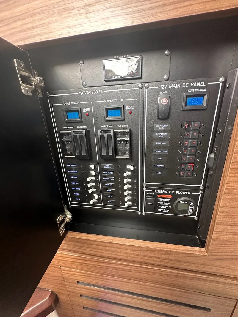 Slide: The Image of Electrical control panel on a 2019 Boston Whaler 350 Realm boat. - 25