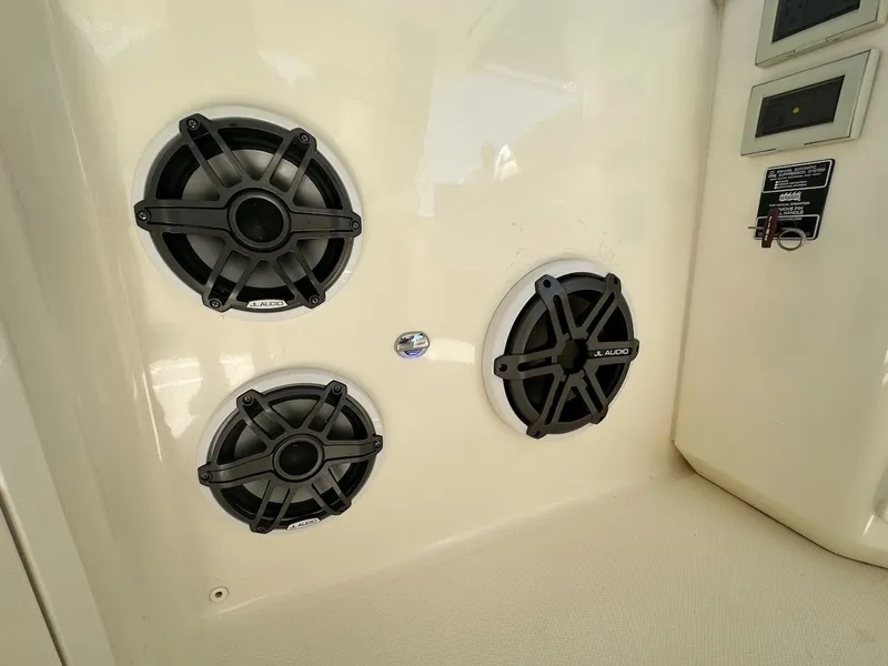 Slide: The Image of 2019 Boston Whaler 350 Realm with JL Audio speakers installed on the interior panel. - 30