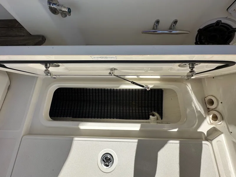 Slide: The Image of Open storage compartment on 2019 Boston Whaler 350 Realm boat deck. - 37