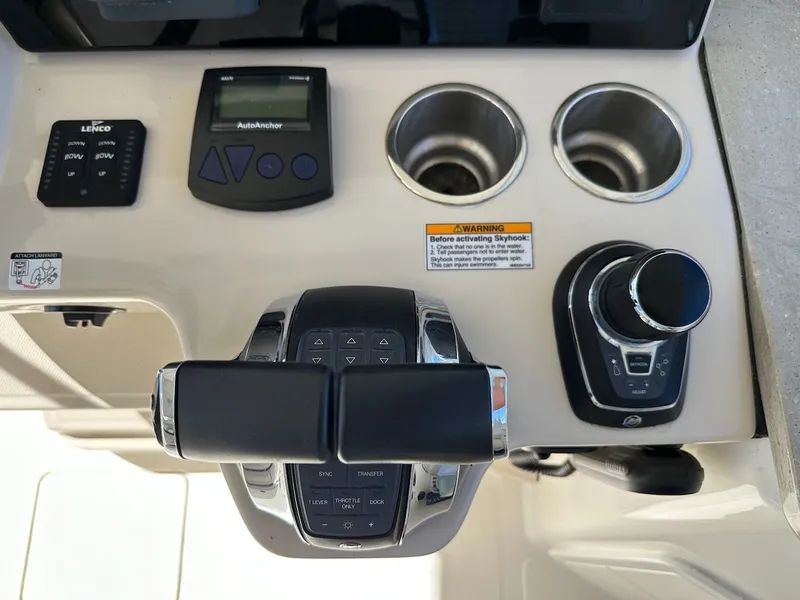Slide: The Image of Control panel of 2019 Boston Whaler 350 Realm with joystick and cup holders. - 43