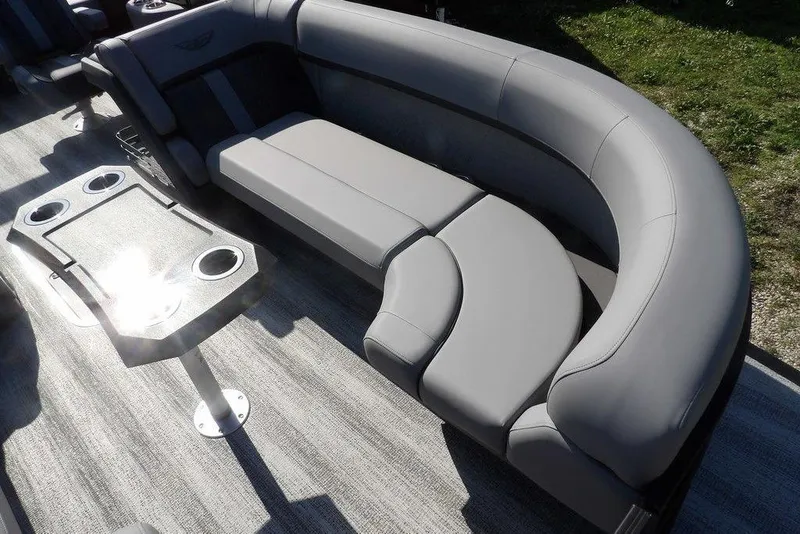 Slide: The Image of 2026 Bennington M Swingback 24 MSB boat interior with gray seating and table. - 11