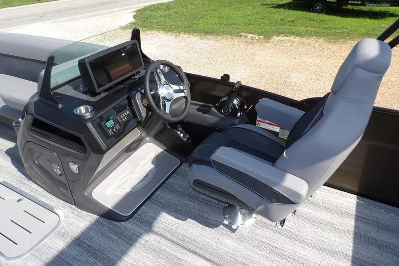 Slide: The Image of 2026 Bennington M Swingback 24 MSB boat interior with modern helm and seating. - 19