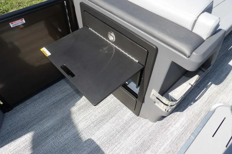 Slide: The Image of 2026 Bennington M Swingback 24 MSB with open storage compartment and sleek seating. - 22