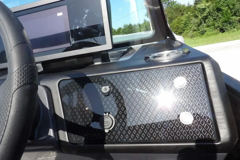 Slide: The Image of Dashboard of 2026 Bennington M Swingback 24 MSB with modern controls and steering wheel. - 26