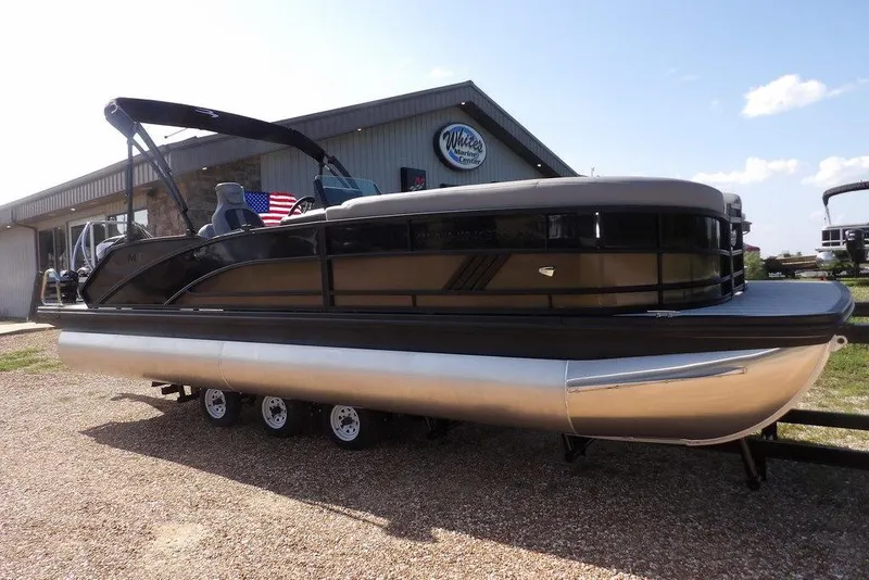 Slide: The Image of 2026 Bennington M Swingback 24 MSB pontoon boat on a trailer, rear view. - 3