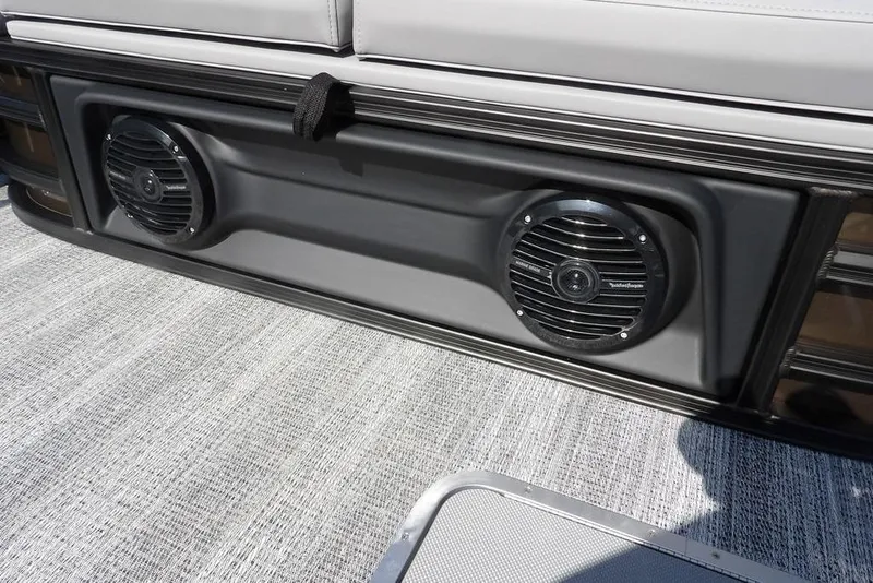 Slide: The Image of 2026 Bennington M Swingback 24 MSB boat speakers on deck, close-up view. - 35