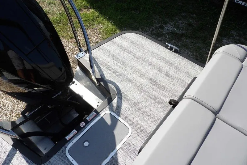 Slide: The Image of 2026 Bennington M Swingback 24 MSB boat deck with seating and motor. - 36