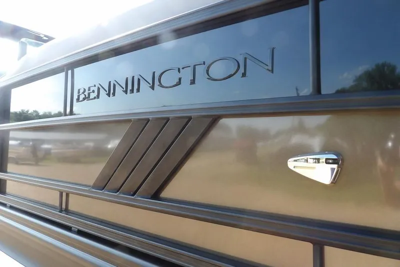 Slide: The Image of 2026 Bennington M Swingback 24 MSB boat exterior with logo detail. - 45
