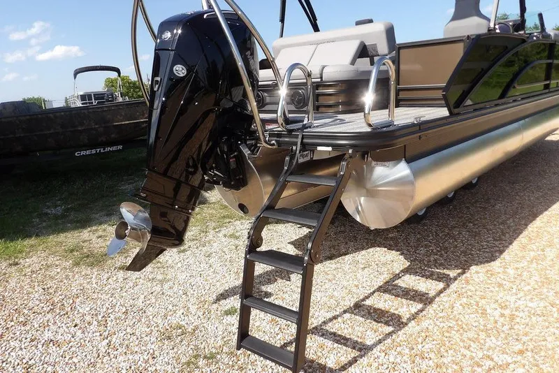 Slide: The Image of 2026 Bennington M Swingback 24 MSB pontoon boat with outboard motor and boarding ladder. - 47