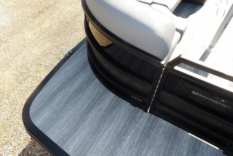 Slide: The Image of 2026 Bennington M Swingback 24 MSB pontoon boat, featuring sleek design and comfortable seating. - 8