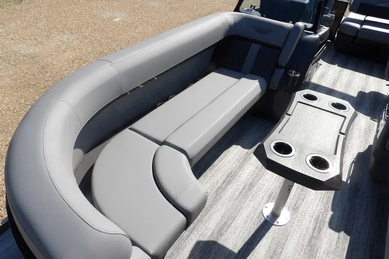 Slide: The Image of 2026 Bennington M Swingback 24 MSB pontoon boat interior with gray seating and table. - 9