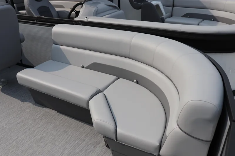 Slide: The Image of Luxurious seating on 2025 Flagship Freedom 22 CU boat, featuring sleek gray upholstery. - 6
