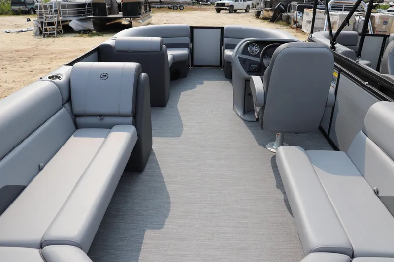 Slide: The Image of 2025 Flagship Freedom 22 CU pontoon boat interior with gray seating and steering console. - 8