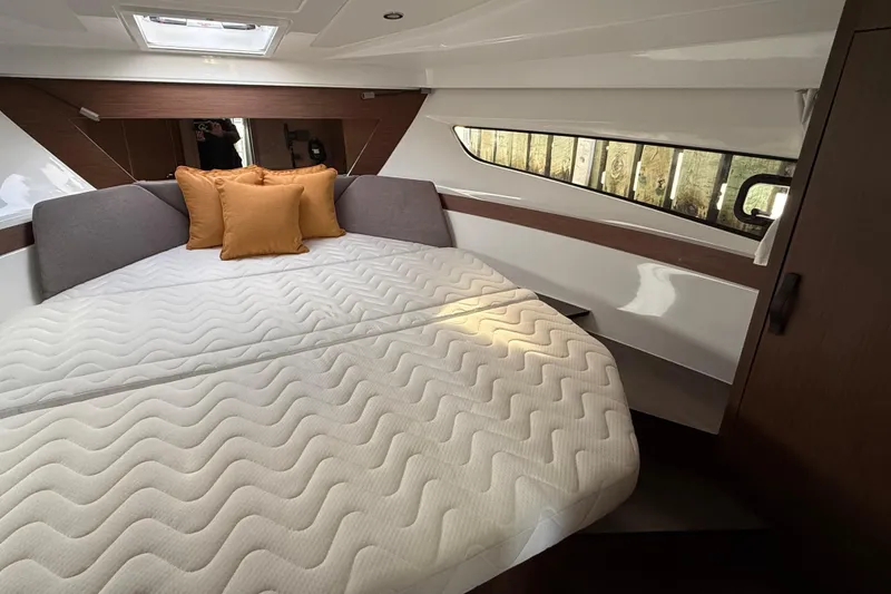 Slide: The Image of Luxurious cabin interior of 2026 Beneteau Antares 11 Fly with cozy bedding. - 21