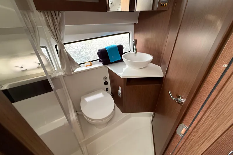 Slide: The Image of Modern bathroom interior of 2026 Beneteau Antares 11 Fly yacht, featuring sleek design and amenities. - 26