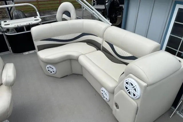 Slide: The Image of Luxurious seating on 2014 Qwest LS 820 XRE Cruise pontoon boat with built-in speakers. - 11