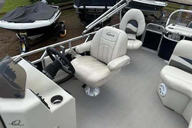 Slide: The Image of Interior of a 2014 Qwest LS 820 XRE Cruise pontoon boat with beige seating. - 12